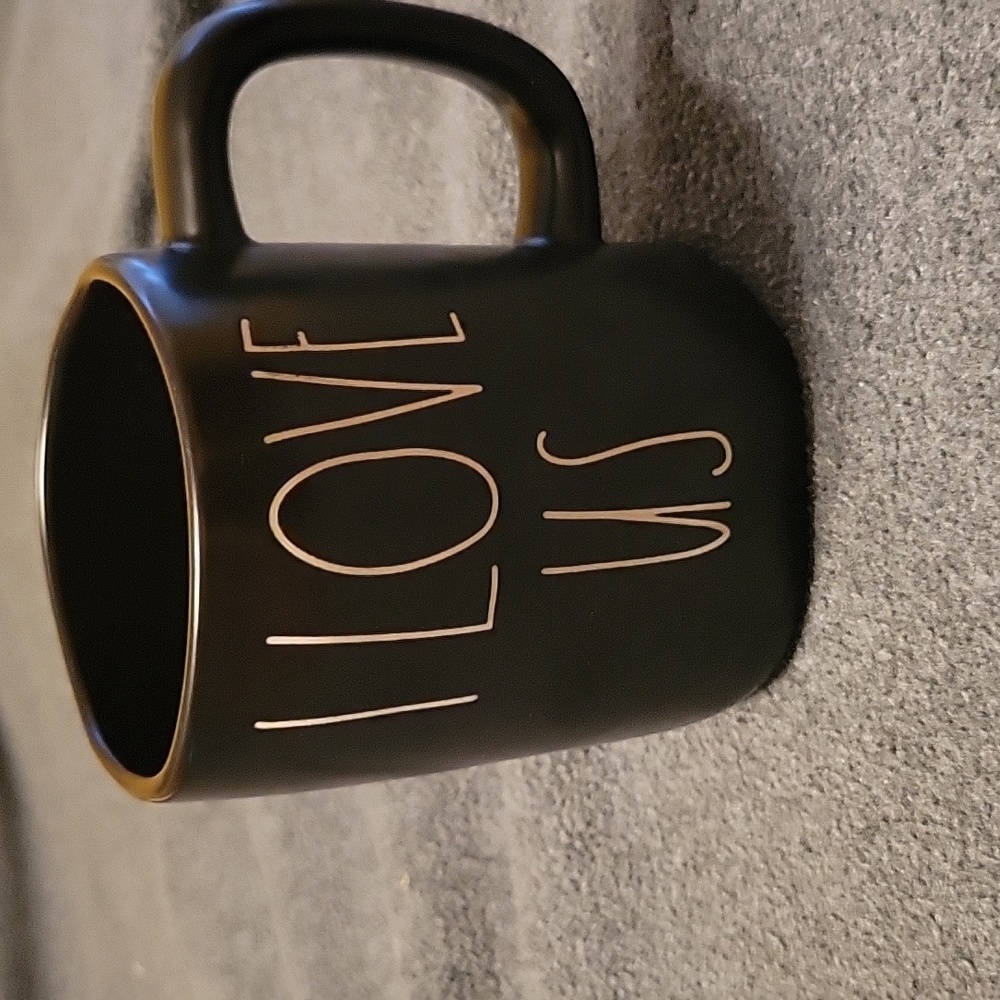 Rae Dunn black ceramic coffee mug that says...I Love Us